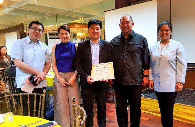 Tanauan, Leyte Mayor Pel Tecson displays the certificate of excellence after the awarding ceremonies at Club Filipino. With Mayor Tecson is his wife Penelope (2nd from left) and Leyte Vice Governor Carlo P. Loreto (4th from left)